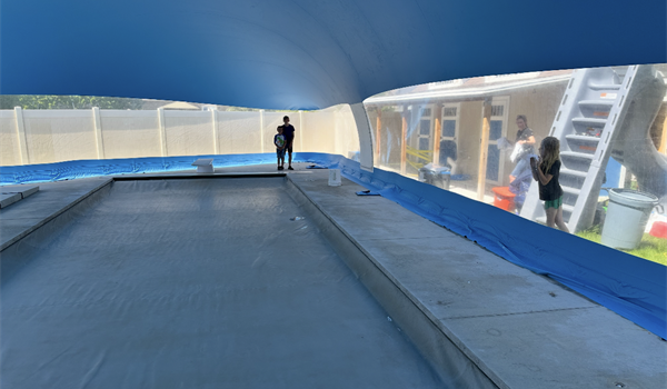 Inside a vinyl pool bubble enclosure